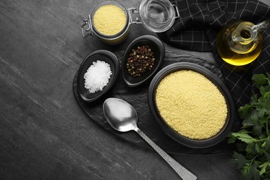 Photo of Raw couscous and ingredients on grey table, flat lay. Space for text