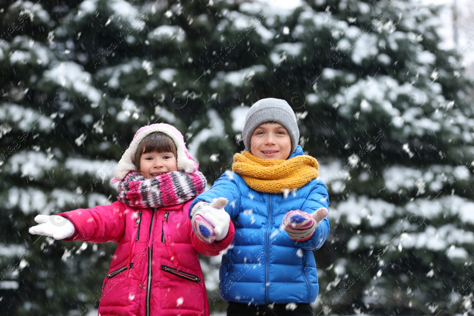 Photo of Happy children playing outdoors on snowy day