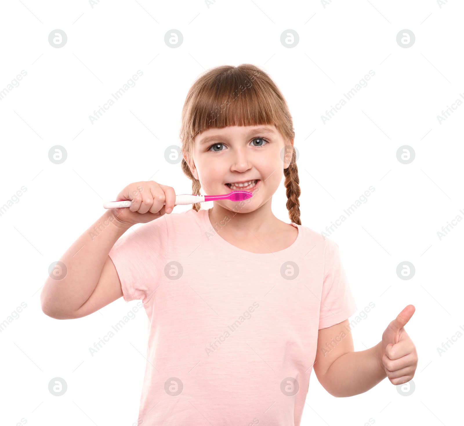 Photo of Little girl brushing teeth on white background