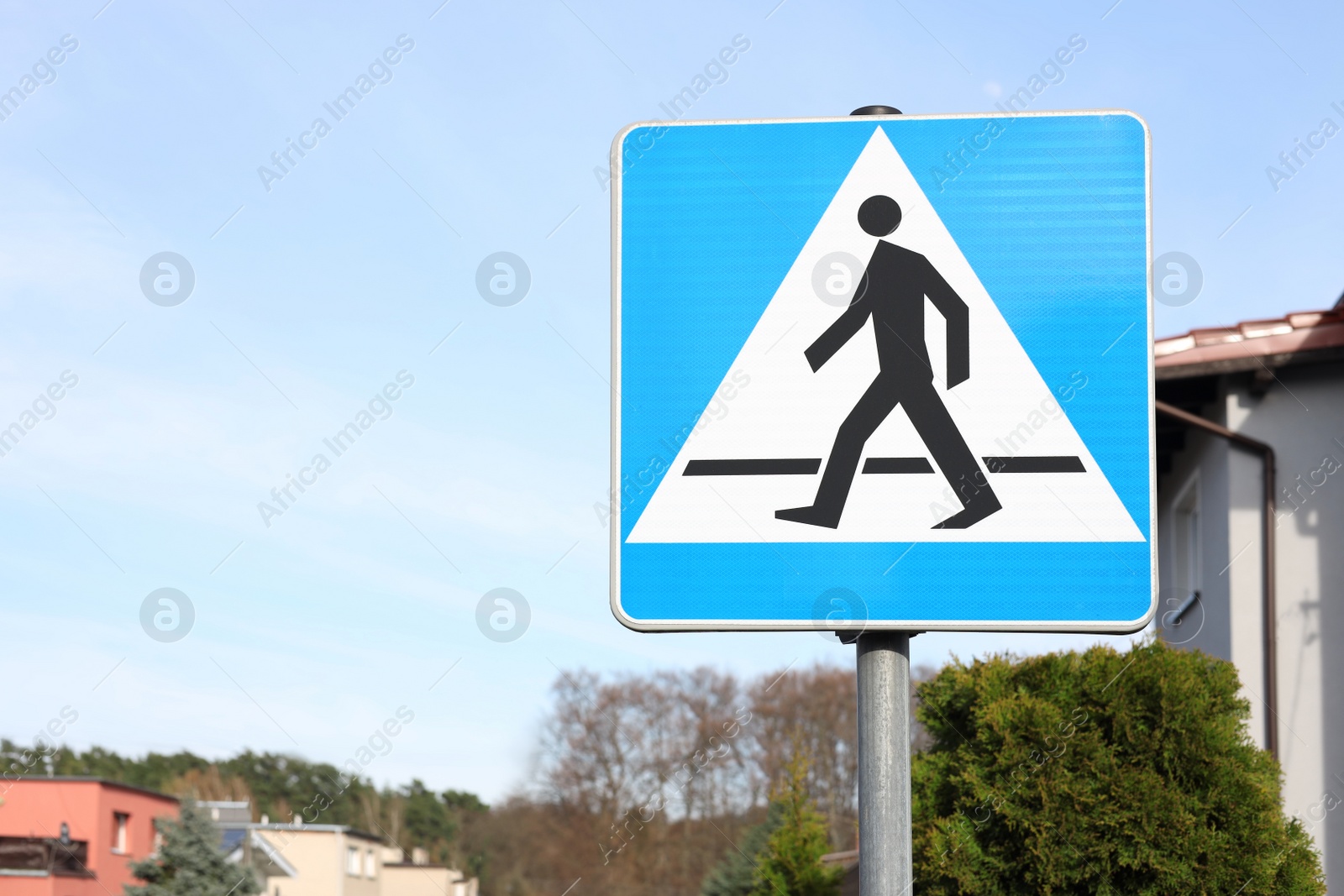 Photo of Traffic sign Pedestrian Crossing on city street, space for text