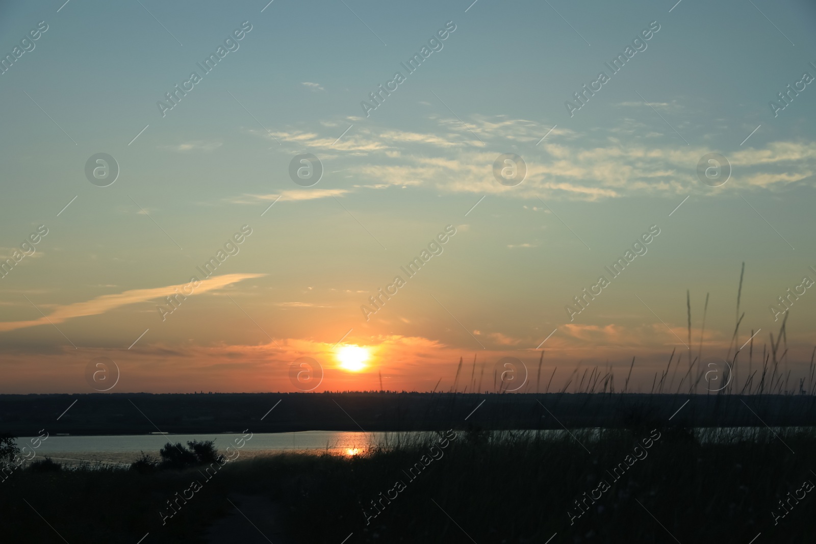 Photo of Picturesque view of tranquil river at sunrise