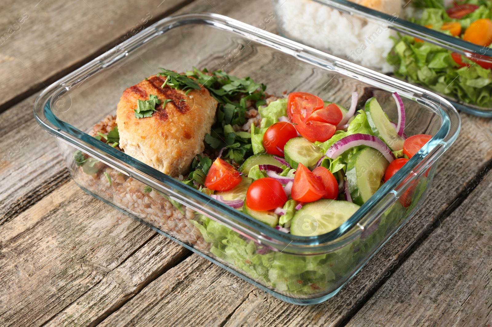 Photo of Healthy meal. Containers with different products on wooden table, closeup