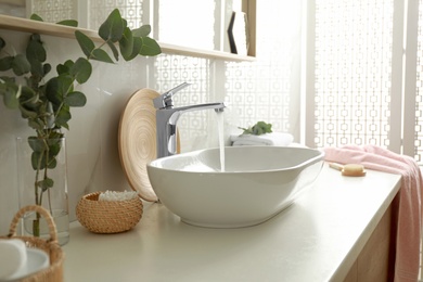 Photo of Stylish white sink in modern bathroom interior