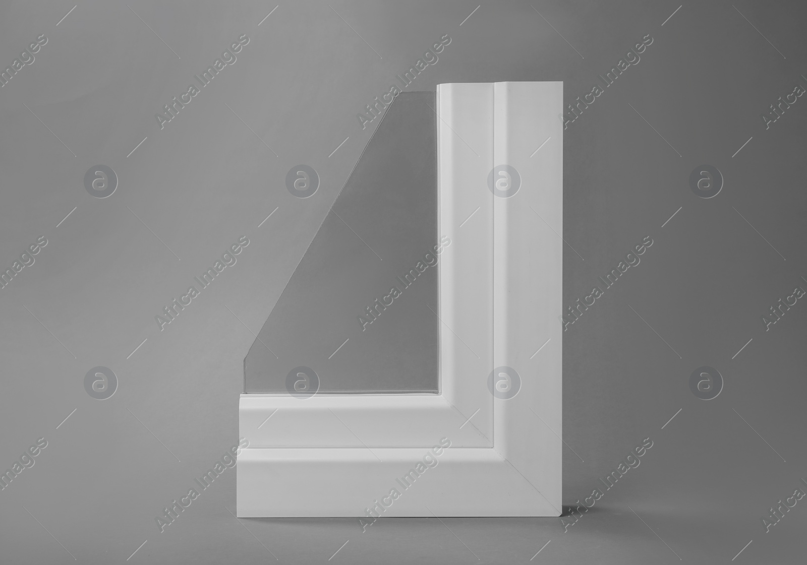 Photo of Sample of modern window profile on grey background