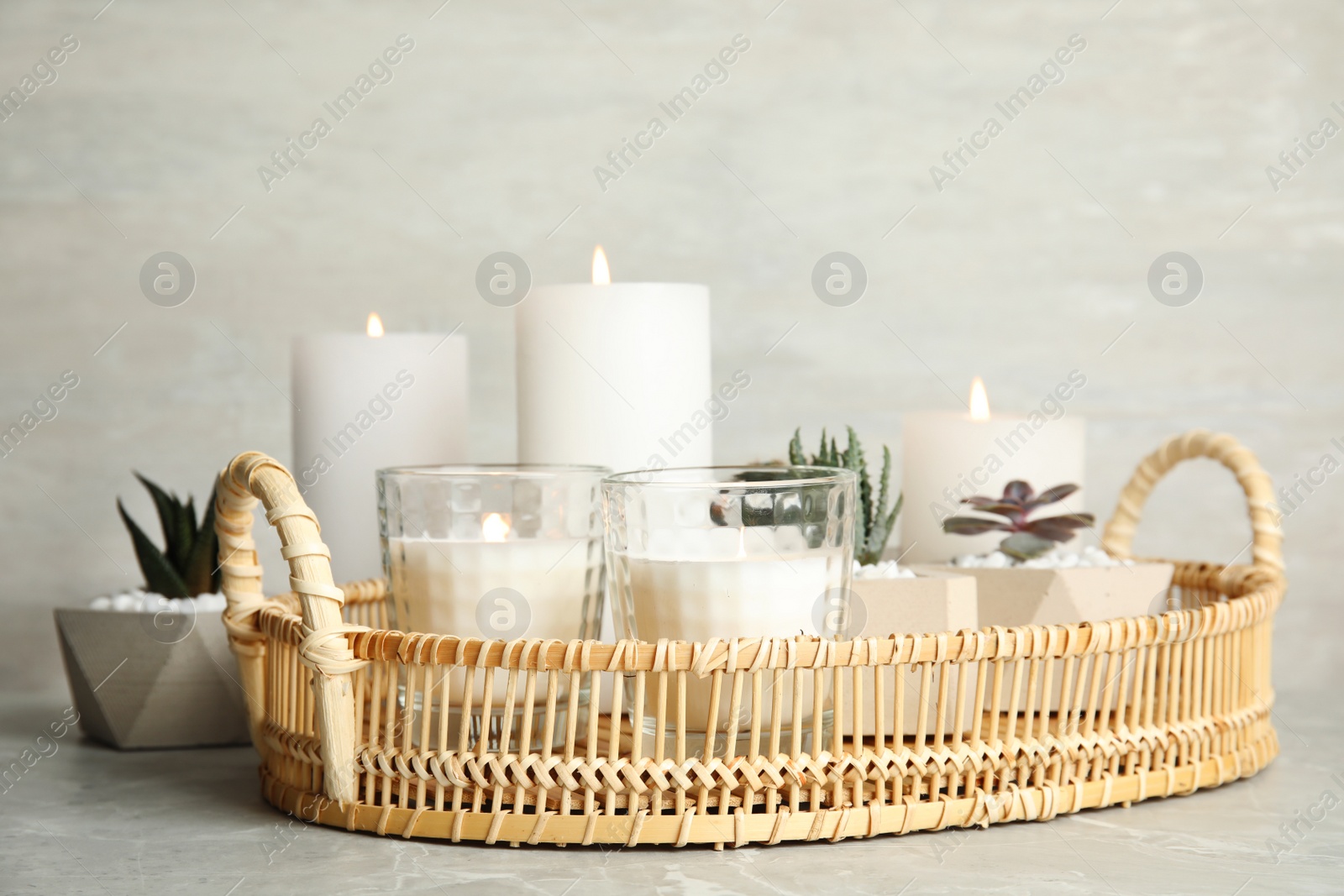 Photo of Beautiful composition with burning candles on table. Space for text