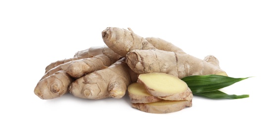 Photo of Whole and cut fresh ginger with leaves isolated on white