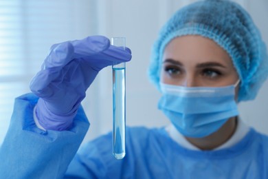 Photo of Scientist working with sample in laboratory, focus on hand. Medical research