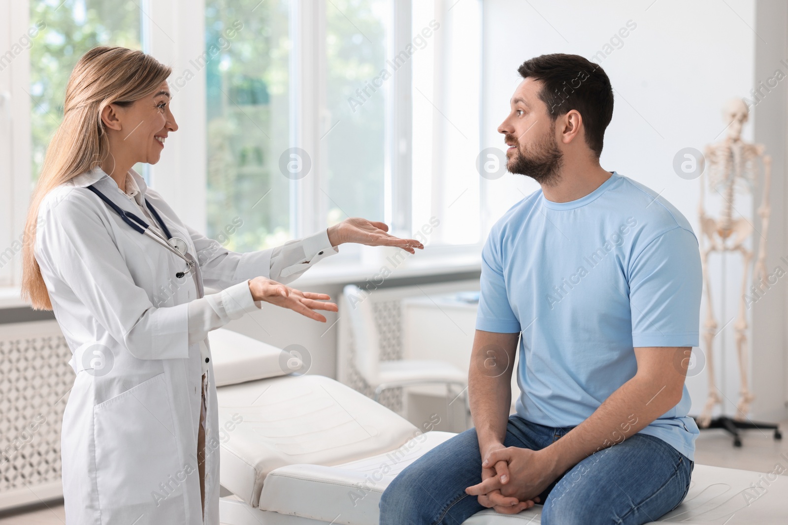 Photo of Professional doctor working with patient in hospital