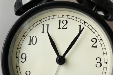 Photo of Alarm clock, closeup. Time change concept