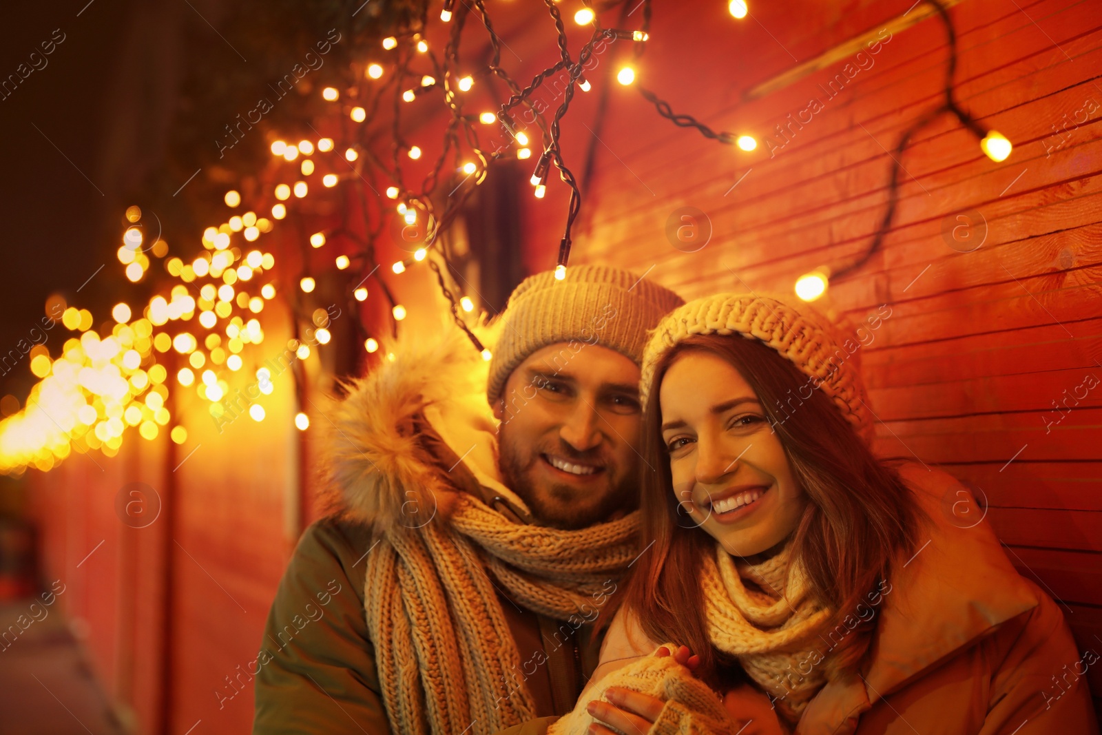 Photo of Happy couple spending time at Christmas fair