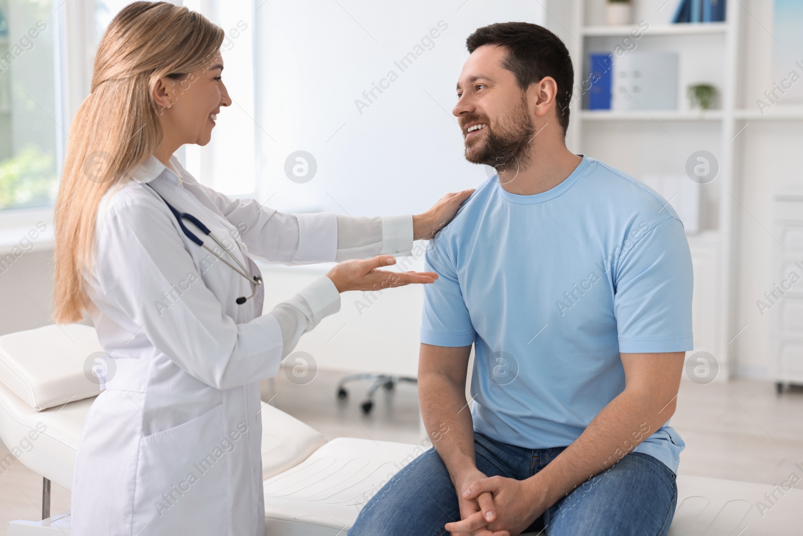 Photo of Professional doctor working with patient in hospital