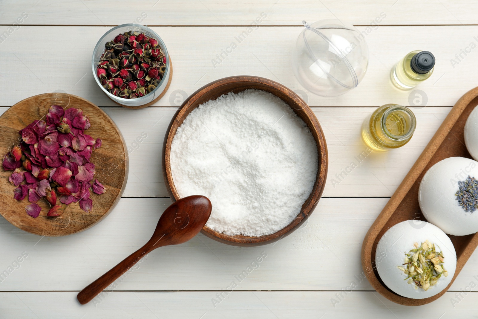 Photo of Flat lay composition with bath bomb ingredients on white wooden table