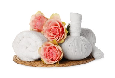 Photo of Beautiful spa composition with rolled towel, flowers and herbal bags on white background