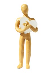 Photo of Yellow plasticine human figure with paper heart isolated on white