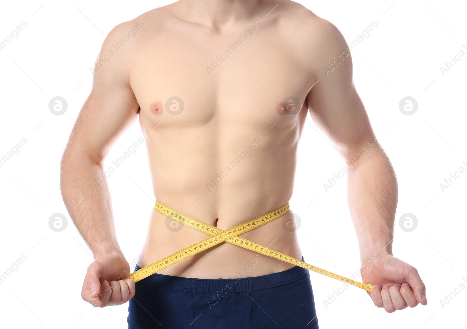 Photo of Young man with measuring tape showing his slim body on white background, closeup