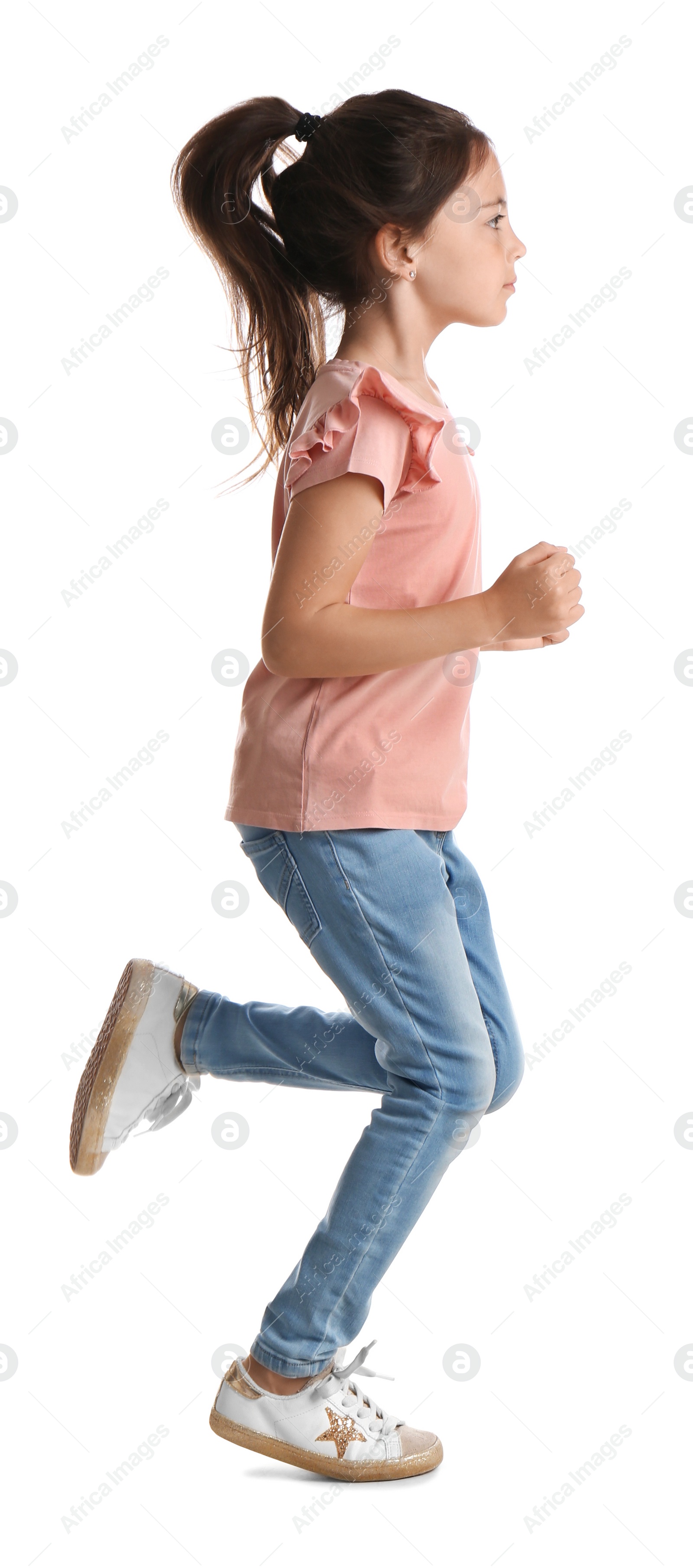 Photo of Cute little girl running on white background