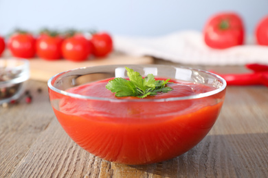 Delicious fresh tomato sauce on wooden table, closeup