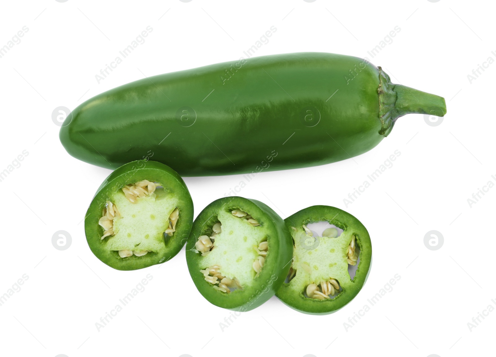 Photo of Whole and cut green hot chili peppers isolated on white, top view