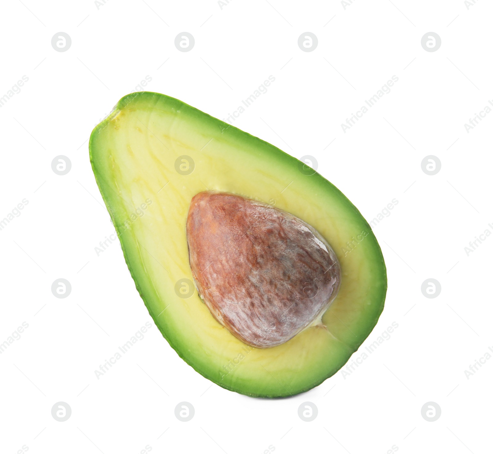 Photo of Half of ripe avocado with pit on white background