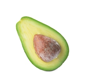 Half of ripe avocado with pit on white background