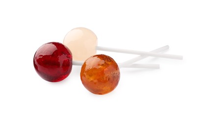 Photo of Three tasty colorful lollipops isolated on white