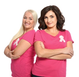 Photo of Women with silk ribbons on white background. Breast cancer awareness concept