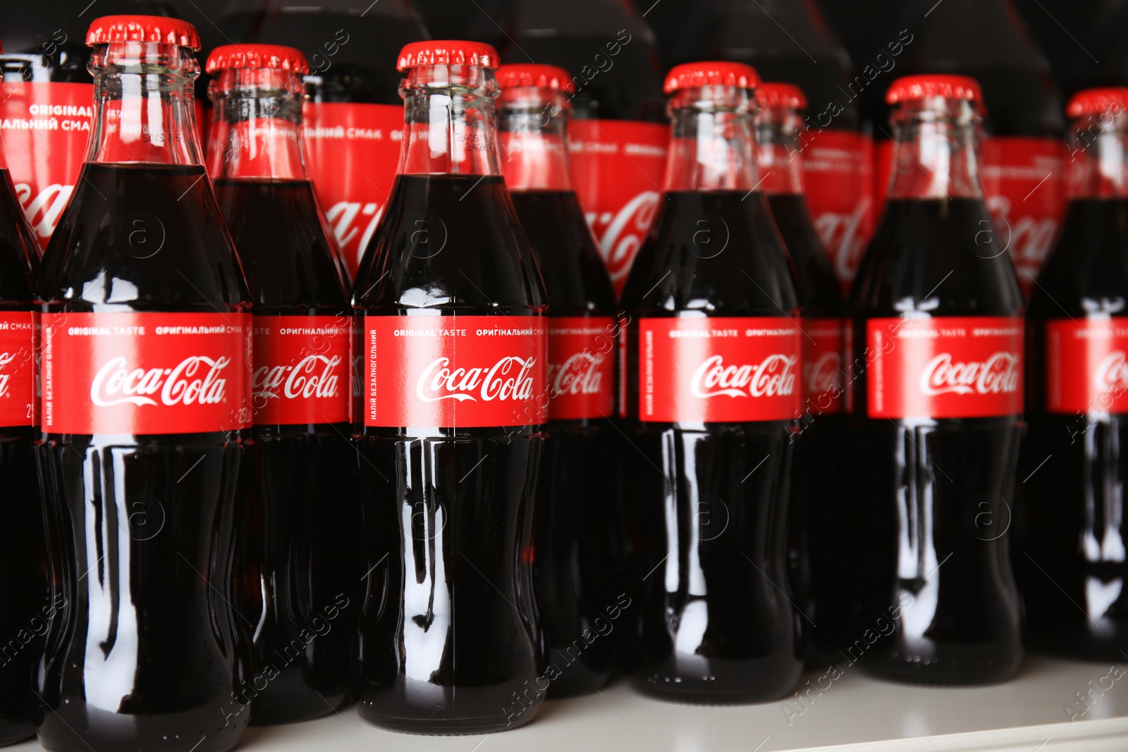 Photo of MYKOLAIV, UKRAINE - NOVEMBER 14, 2018: Many bottles of Coca-Cola on display in store