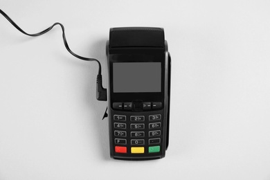 Modern payment terminal on grey background, top view. Space for text