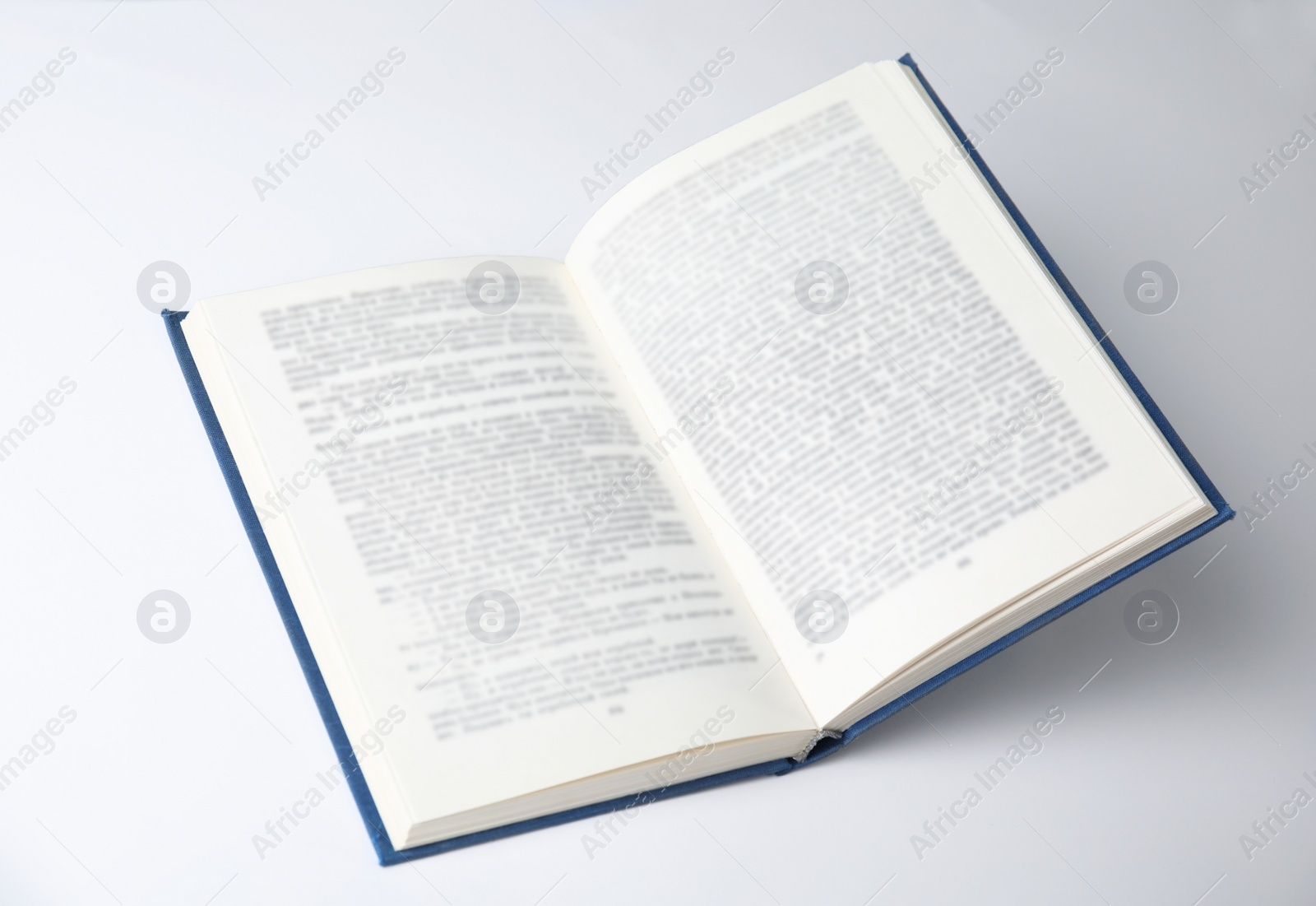 Photo of Open book with hardcover on white background