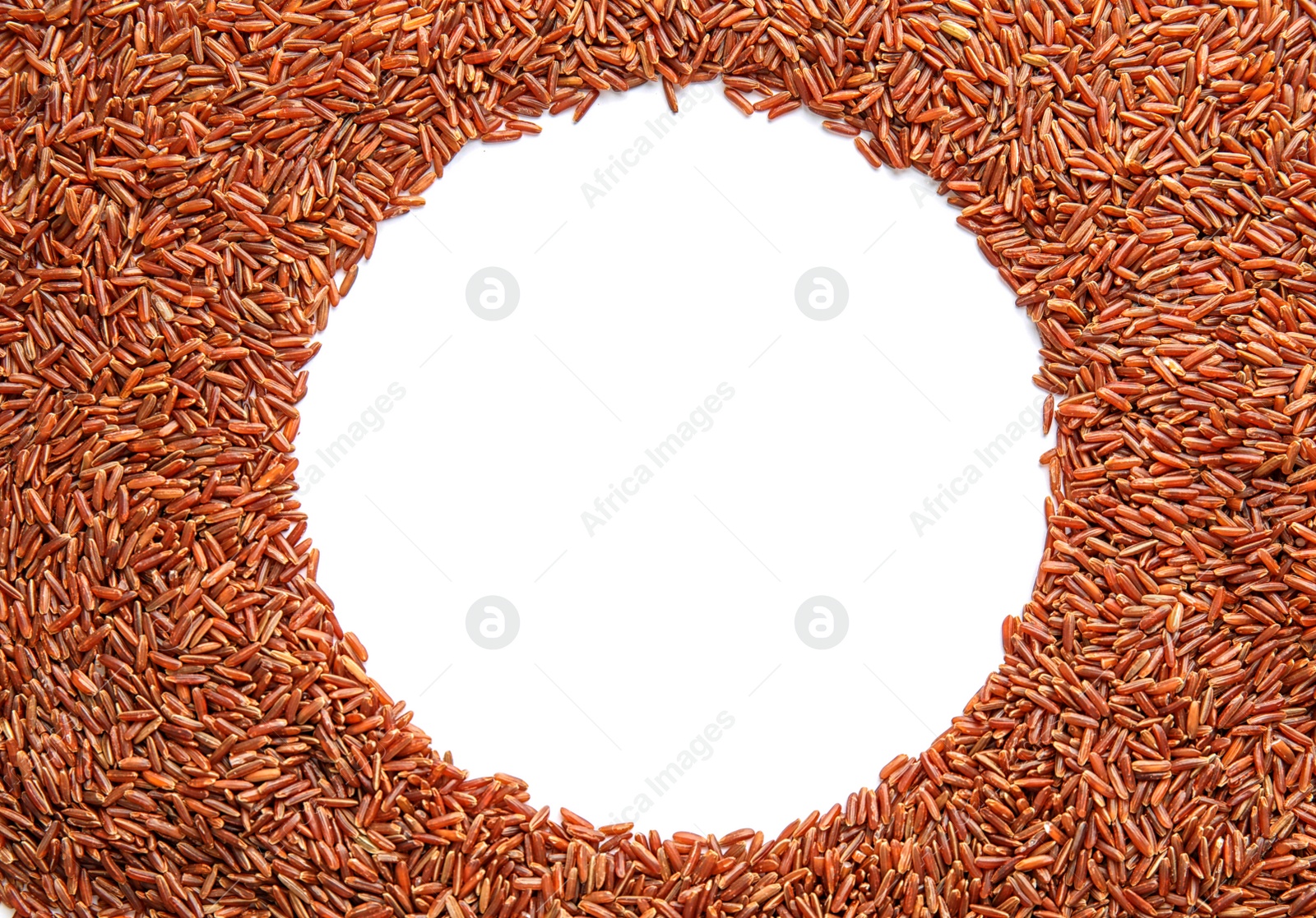 Photo of Frame made of uncooked red rice on white background, top view. Space for text