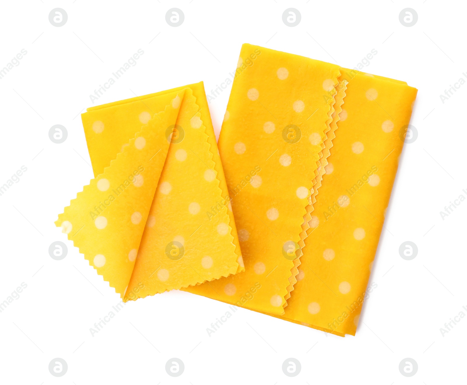 Photo of Reusable beeswax food wraps on white background, top view