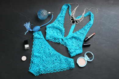 Photo of Flat lay composition with women's underwear on black stone background