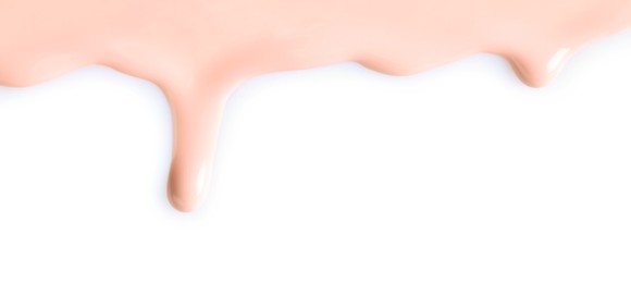 Photo of Light pink nail polish flowing on white background