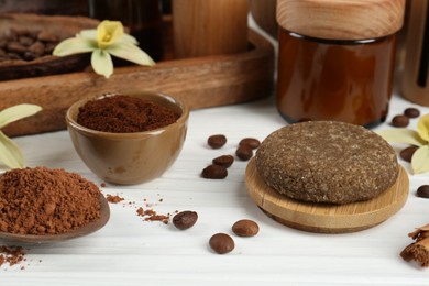 Homemade cosmetic products and fresh ingredients on white wooden table, closeup