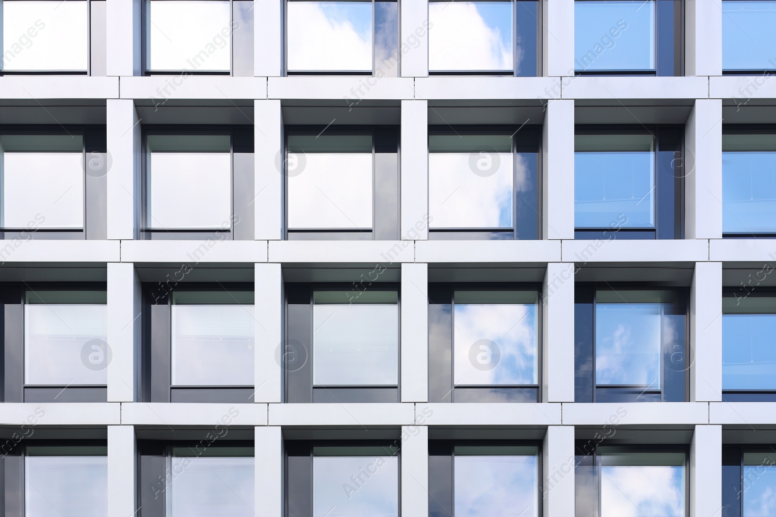 Photo of Modern building with tined windows, low angle view