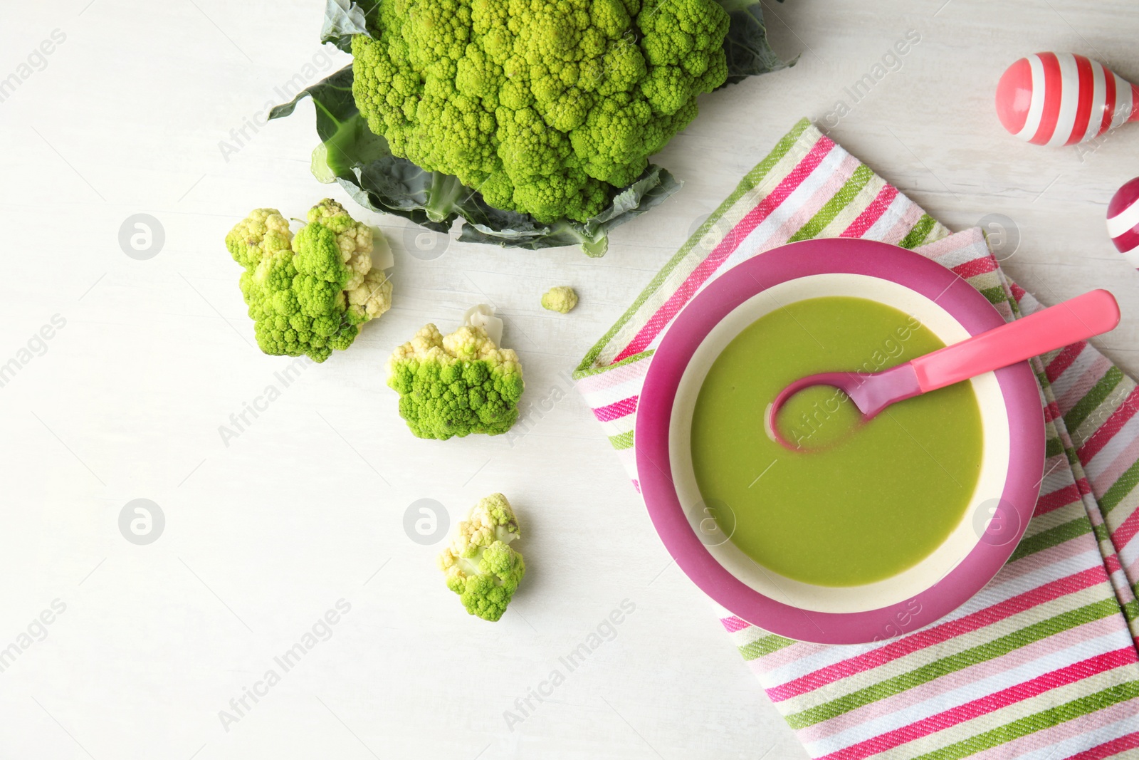 Photo of Flat lay composition with plate of healthy baby food on light background