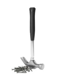Photo of Hammer and metal nails on white background