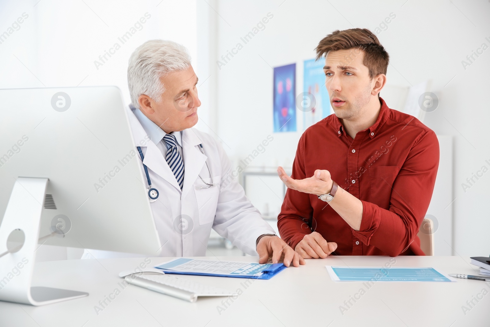 Photo of Man with health problems visiting urologist at hospital