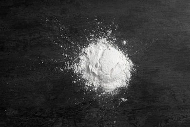 Photo of Heap of wheat flour on gray background, top view