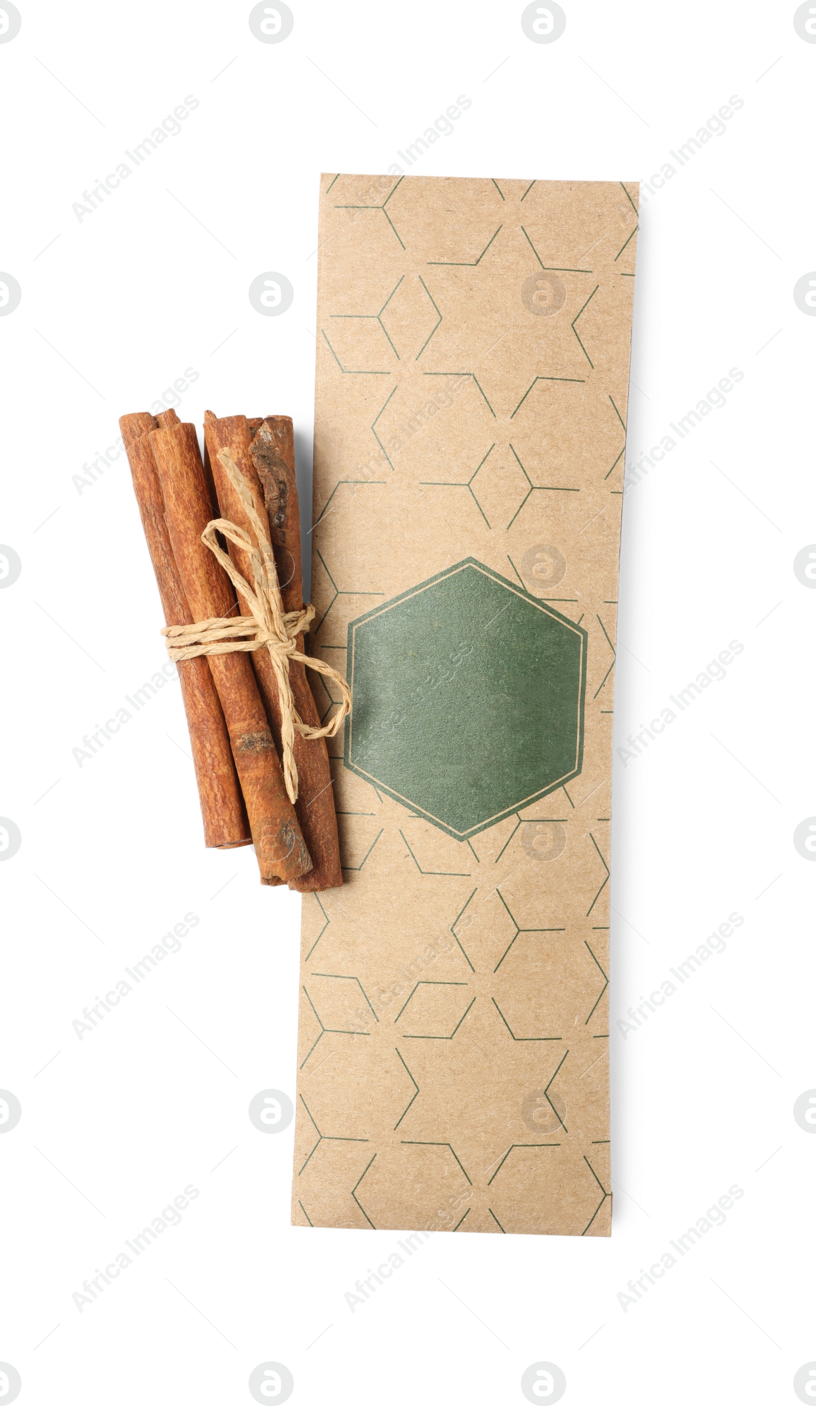 Photo of Scented sachet and cinnamon on white background, top view