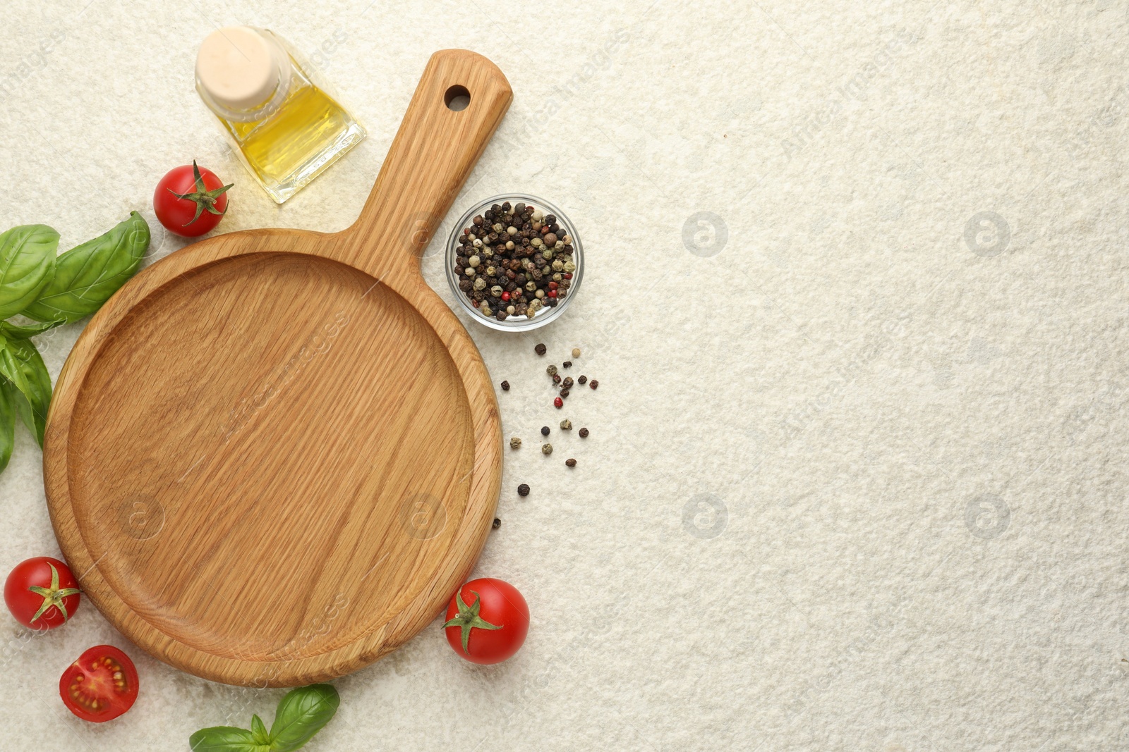 Photo of Cutting board, basil, oil, spices and tomatoes on white textured table, flat lay. Space for text