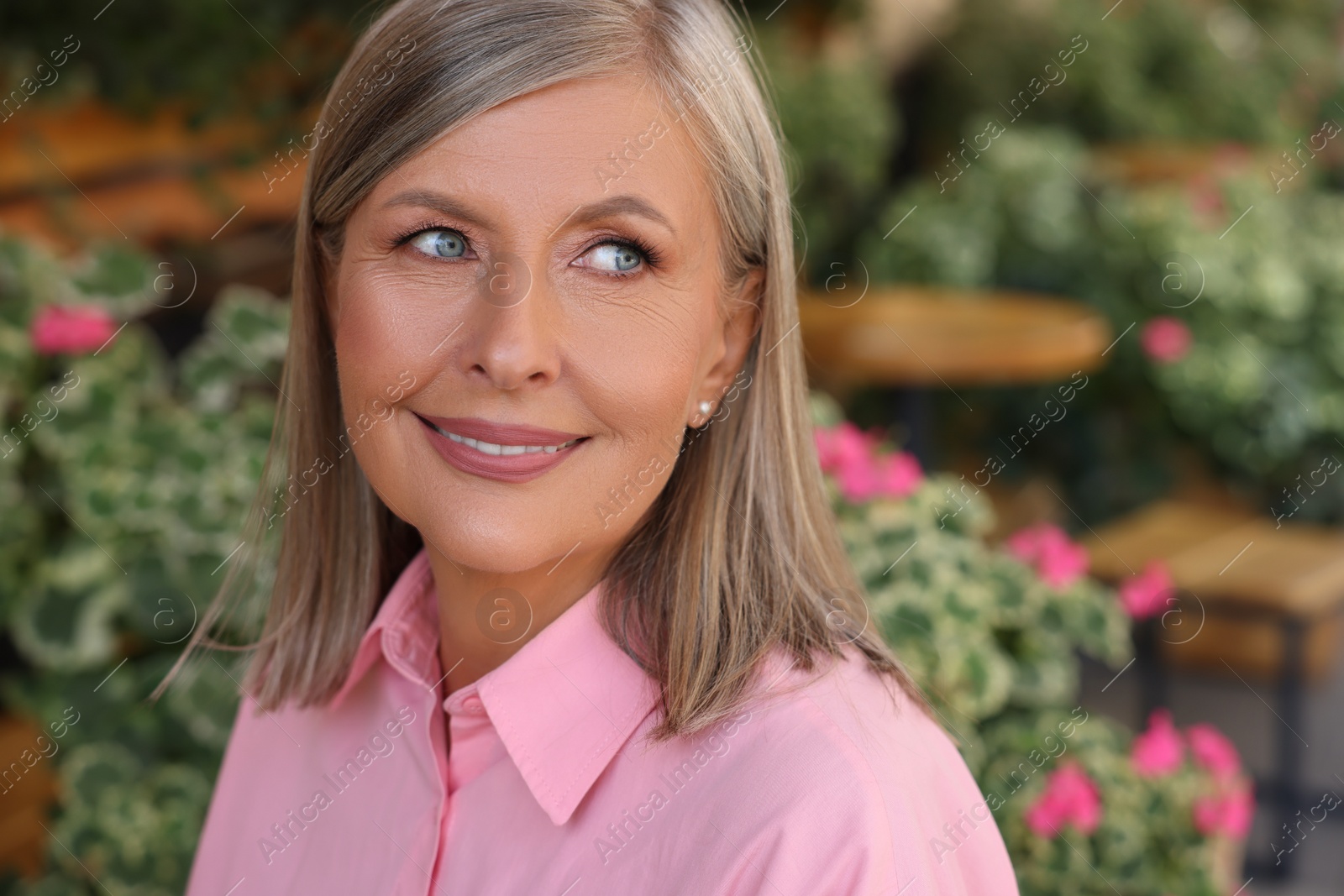 Photo of Portrait of beautiful happy senior woman outdoors