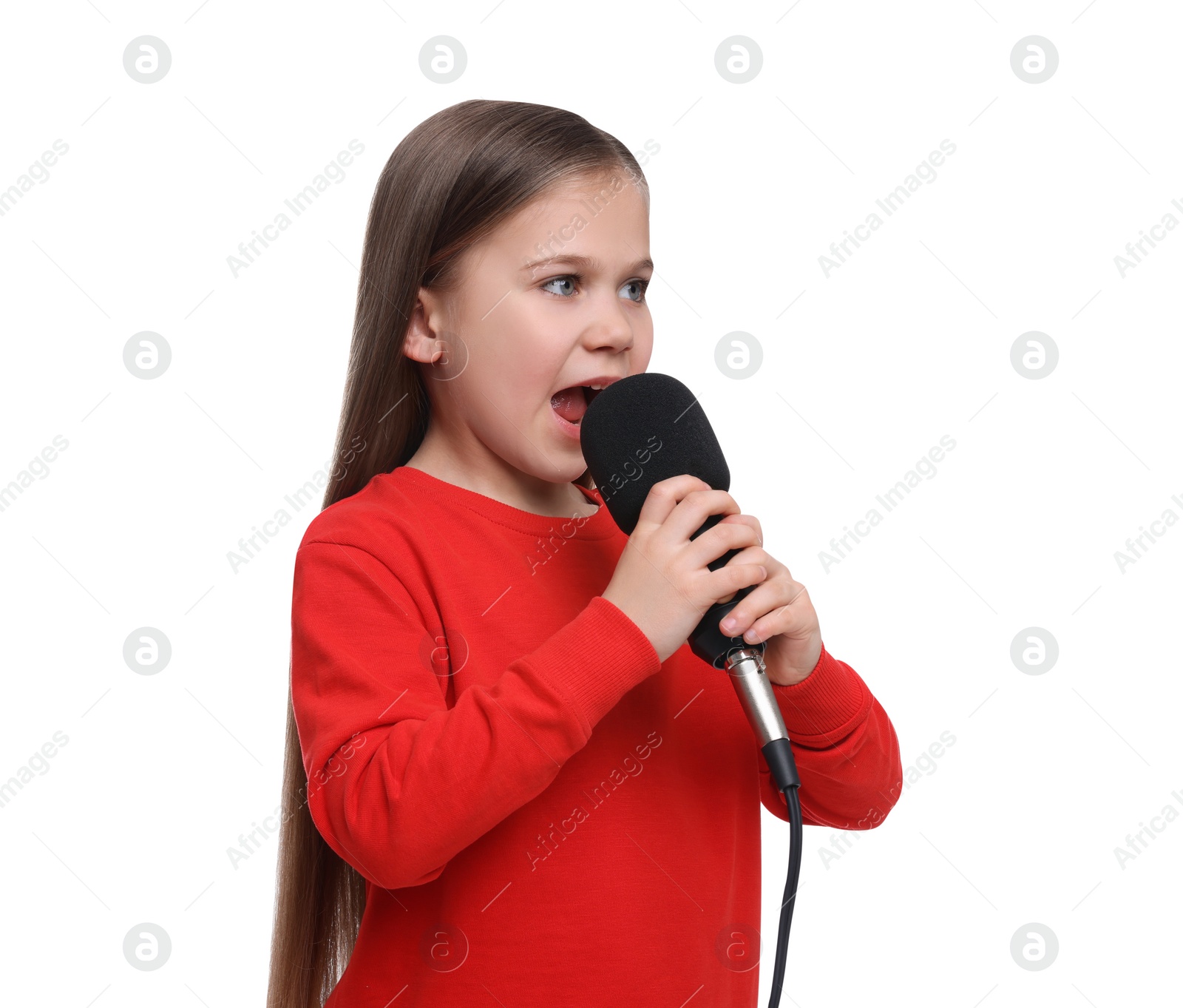 Photo of Cute little girl with microphone singing on white background