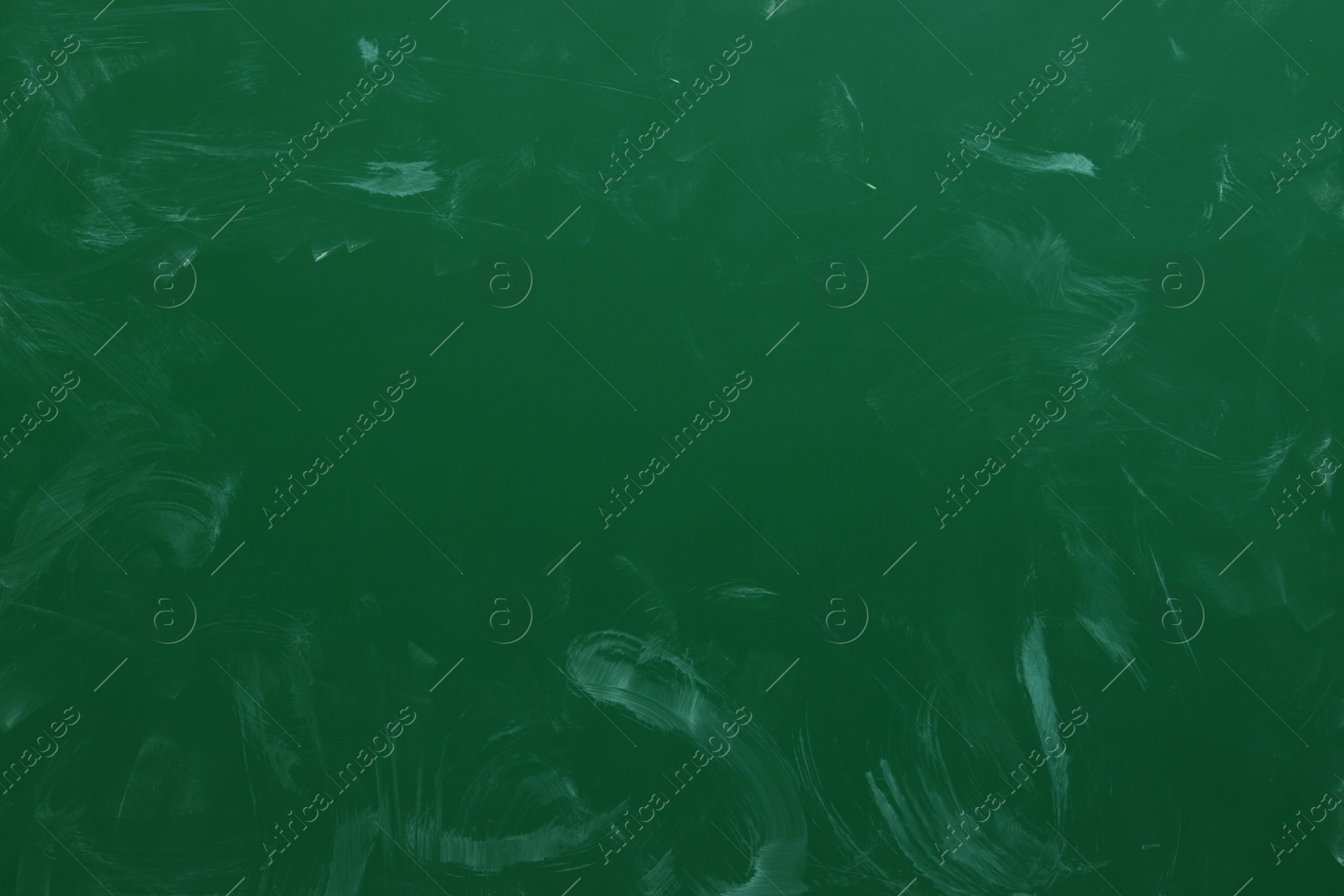 Photo of Dirty green chalkboard as background. School equipment