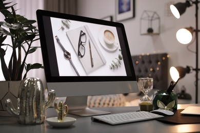 Photo of Stylish workplace interior with modern computer on desk