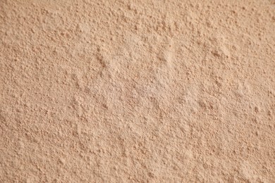 Photo of Loose face powder as background, closeup view
