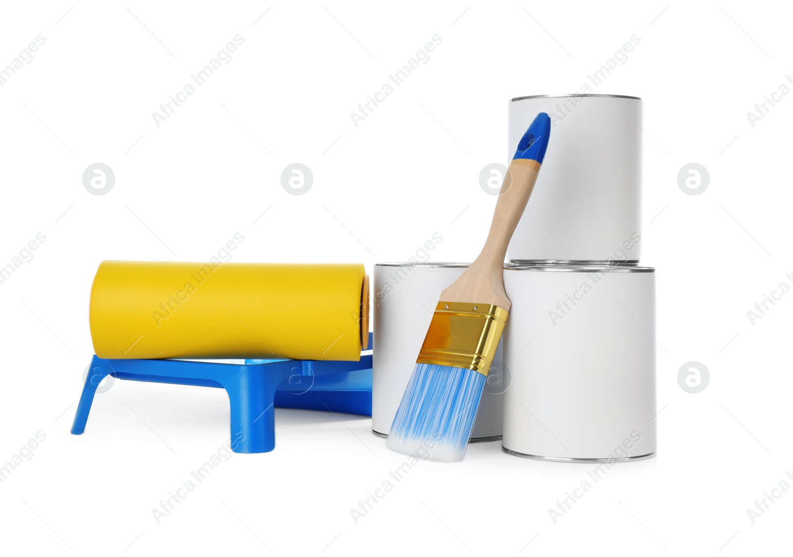 Photo of Closed blank cans of paint with brush, roller and tray isolated on white