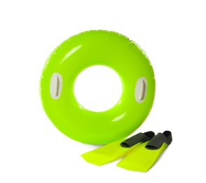 Inflatable ring and flippers on white background. Summer holidays