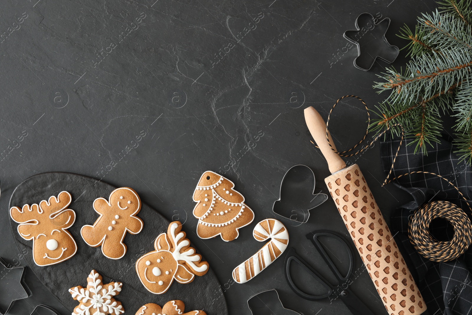 Photo of Flat lay composition with delicious homemade Christmas cookies on black table. Space for text