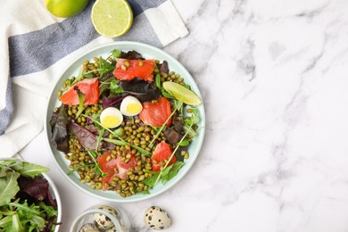 Plate of salad with mung beans on white marble table, flat lay. Space for text